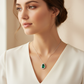 Lab Emerald Pear Halo Pendant Necklace — Square Wear Shot